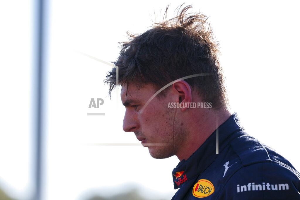 Asanka Brendon Ratnayake Red Bull driver Max Verstappen of the Netherlands looks at his car after he withdrew from the Australian Formula One Grand Prix in Melbourne, Australia, Sunday, April 10, 2022. (AP Photo/Asanka Brendon Ratnayake)