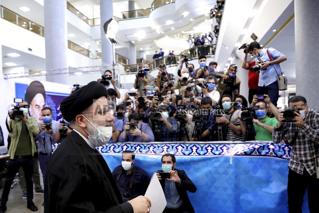 Ebrahim Noroozi Ebrahim Raisi, head of Iran's judiciary attends the Interior Ministry to register his candidacy for the June 18 presidential elections at the elections headquarters of the Interior Ministry in Tehran, Iran, Saturday, May 15, 2021. (AP Photo/Ebrahim Noroozi)