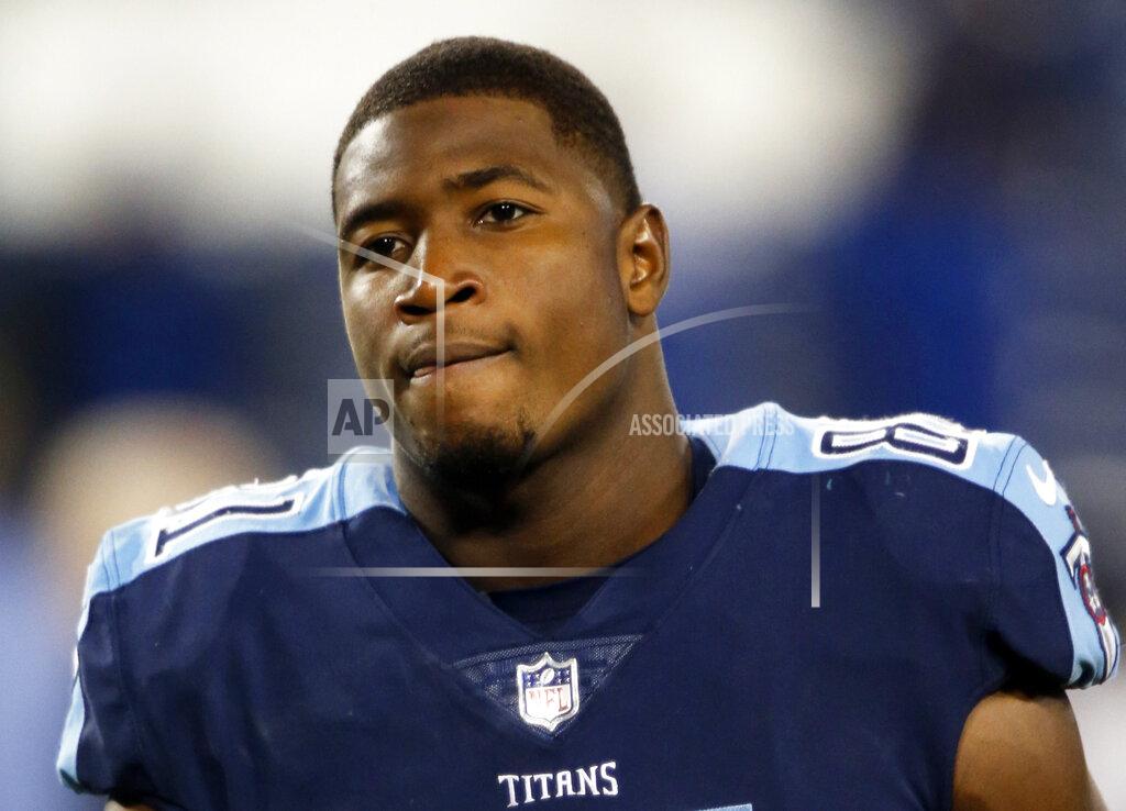 Wade Payne CORRECTS THE IDENTIFICATION OF THE PLAYER TO JONNU SMITH, AND NOT DERRICK MORGAN AS ORIGINALLY SENT. A SUBSTITUTE IMAGE OF DERRICK MORGAN WILL BE SENT AS NY159 - FILE - In this Oct. 16, 2017, file photo, Tennessee Titans outside linebacker Jonnu Smith (81) is seen after an NFL football game against the Indianapolis Colts, in Nashville, Tenn. (AP Photo/Wade Payne, File)