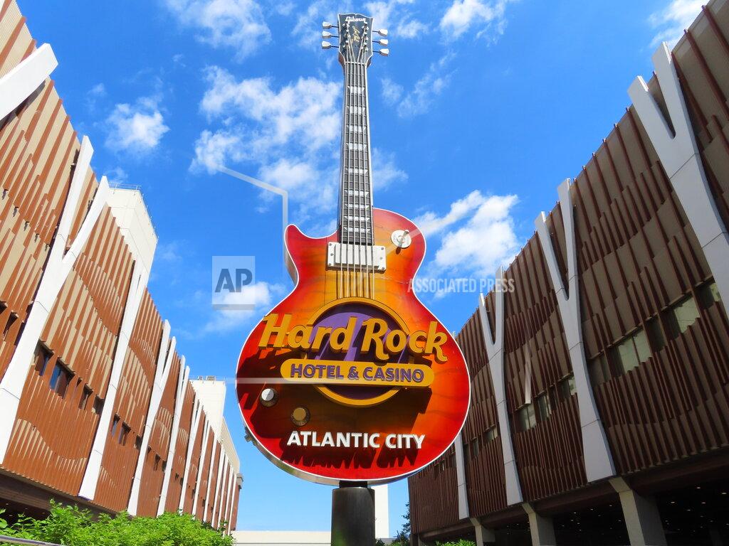Wayne Parry Clouds pass behind the guitar sculpture at the entrance to the Hard Rock casino in Atlantic City, N.J., on June 28, 2022. On Saturday, July 2, 2022, Hard Rock reached agreement with Atlantic City's main casino workers union, ending the last possibility of a strike during the busy July Fourth weekend. (AP Photo/Wayne Parry)