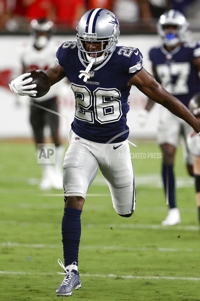 Scott Audette Dallas Cowboys cornerback Jourdan Lewis runs with the football after intercepting a pass by Tampa Bay Buccaneers quarterback Tom Brady during the first half of an NFL football game Thursday, Sept. 9, 2021, in Tampa, Fla. (AP Photo/Scott Audette)