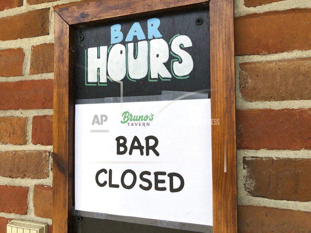 Kevin Mcgill A sign hangs outside Bruno’s Tavern in New Orleans on Tuesday, July 14, 2020. Bruno’s is one of many bars around the city that shut down under new restrictions the state announced over the weekend to fight the spread of coronavirus. Bars in New Orleans had been allowed to open, with limited capacity, a month earlier when the number of hospitalizations from the virus in Louisiana was in decline. (AP Photo/Kevin McGill)