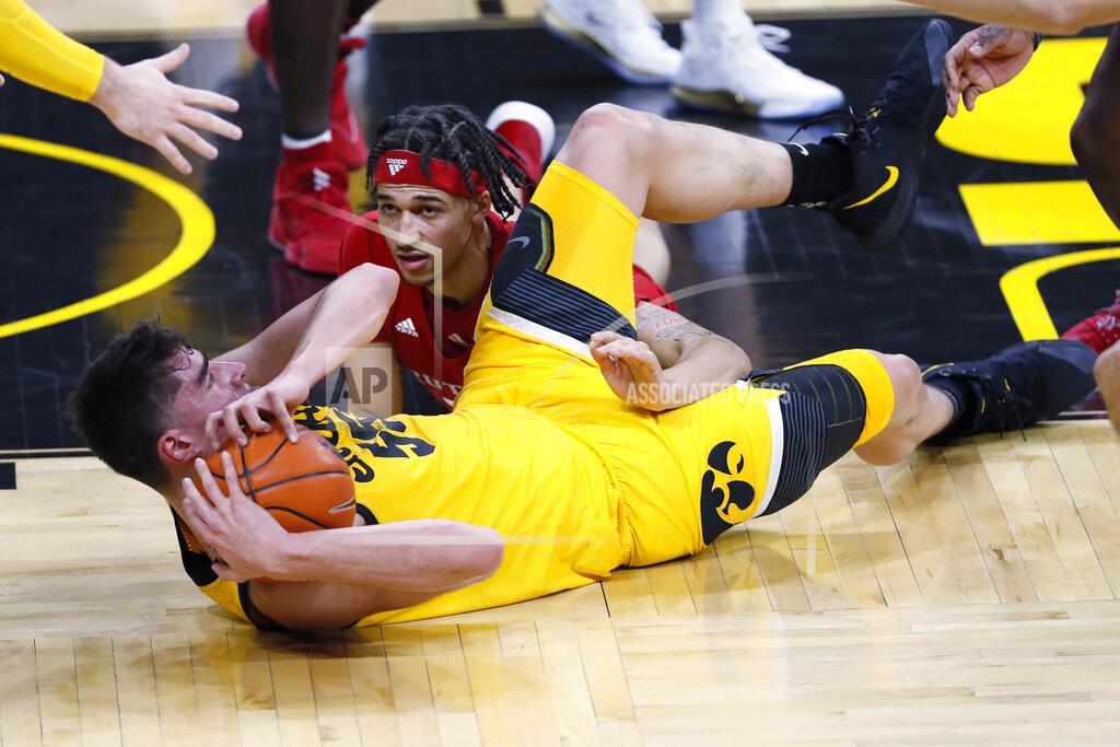 Charlie Neibergall Iowa center Luka Garza, left, fights for a loose ball with Rutgers guard Caleb McConnell during the first half of an NCAA college basketball game, Wednesday, Jan. 22, 2020, in Iowa City, Iowa. (AP Photo/Charlie Neibergall)