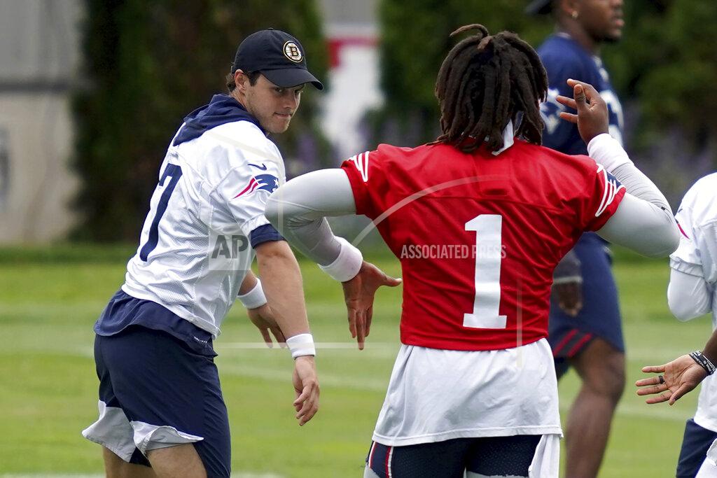 Mary Schwalm New England Patriots punter Jake Bailey and quarterback Cam Newton swing their arms during NFL football practice in Foxborough, Mass., Friday, June 4, 2021. (AP Photo/Mary Schwalm)
