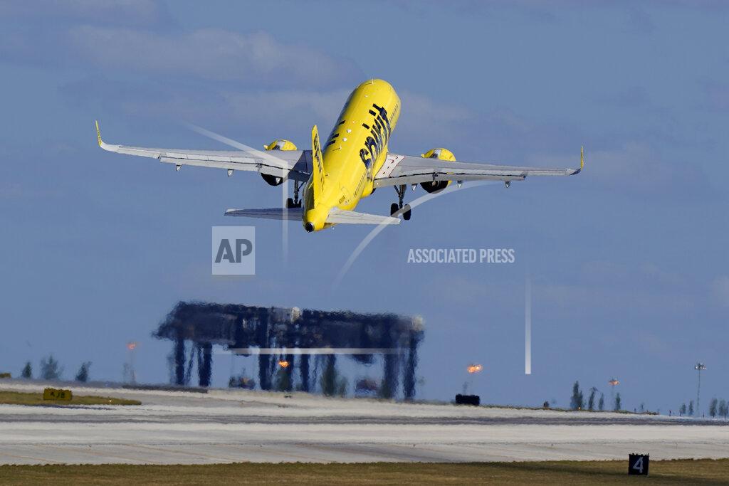 A Spirit Airlines Airbus A320 takes off from Fort Lauderdale-Hollywood International Airport, Tuesday, Jan. 19, 2021, in Fort Lauderdale, Fla. Investors have seemingly cleared airline stocks for takeoff, but the industry still faces a long and bumpy climb. The S&P 500′s airline index has jumped nearly 25% so far in 2021 as vaccine distribution ramps up and begins to clear the way for a full economic recovery. (AP Photo/Wilfredo Lee)