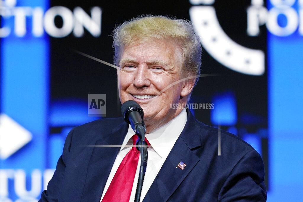 Ross D. Franklin FILE - Former President Donald Trump smiles as he pauses while speaking to supporters at a Turning Point Action gathering in Phoenix, July 24, 2021. A criminal case brought by special counsel John Durham, the prosecutor appointed to investigate potential government wrongdoing in the early days of the Trump-Russia probe, heads to trial in Washington's federal court on May 16. The case centers on a single false statement that Michael Sussmann, a cybersecurity lawyer who represented the Hillary Clinton presidential campaign in 2016, is alleged to have made to the FBI during a meeting that year. (AP Photo/Ross D. Franklin, File)