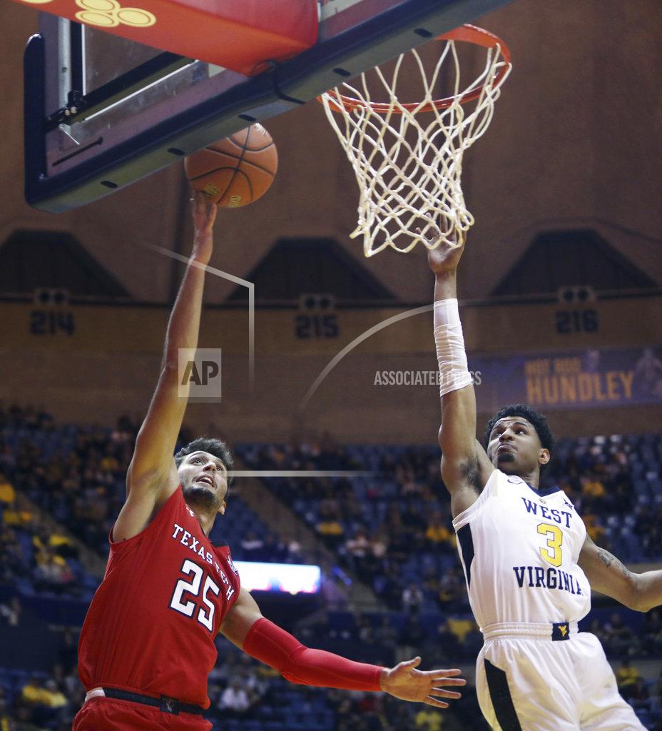 Ray Thompson Texas Tech guard Davide Moretti (25) drives to the basket while defended by West Virginia guard James Bolden (3) during the first half of an NCAA college basketball game Wednesday, Jan. 2, 2019, in Morgantown, W.Va. (AP Photo/Raymond Thompson)