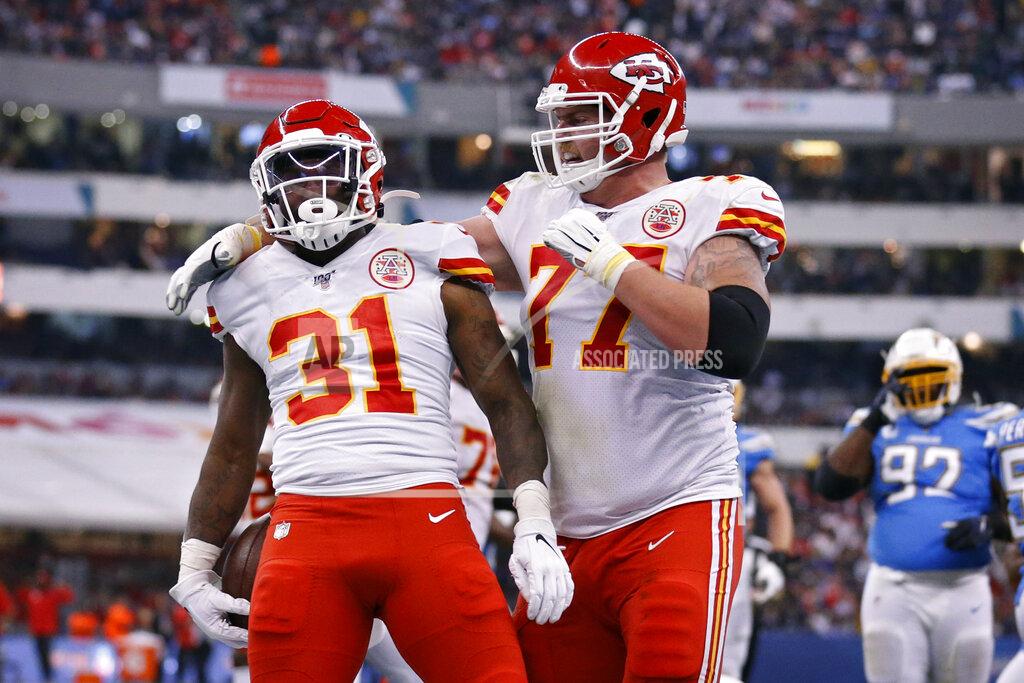 Rebecca Blackwell Kansas City Chiefs running back Darrel Williams (31) celebrates with teammate offensive guard Andrew Wylie after scoring a touchdown during the second half of an NFL football game against the Los Angeles Chargers, Monday, Nov. 18, 2019, in Mexico City. (AP Photo/Rebecca Blackwell)