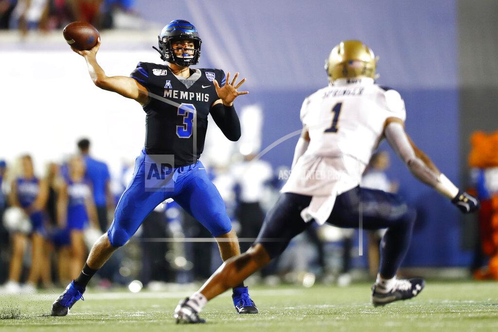 Joe Rondone Memphis quarterback Brady White throws the ball past Navy's Jacob Springer during an NCAA college football game Thursday, Sept. 26, 2019, in Memphis Tenn. (Joe Rondone/The Commercial Appeal via AP)