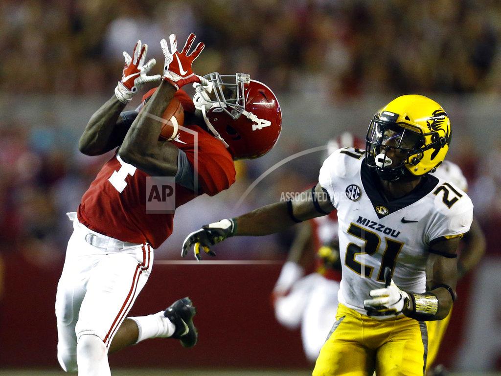 Butch Dill FILE - In this Oct. 13, 2018, file photo, Alabama wide receiver Jerry Jeudy (4) catches a pass next to Missouri defensive back Christian Holmes (21) during the second half of an NCAA college football game, in Tuscaloosa, Ala. Jeudy was named to The Associated Press Midseason All-America team, Tuesday, Oct. 16, 2018. (AP Photo/Butch Dill, File)