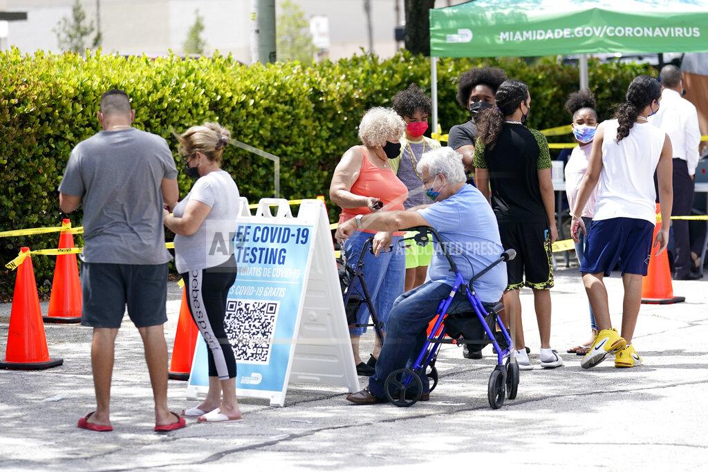 Lynne Sladky People wait in line at a Miami-Dade County COVID-19 testing site, Monday, July 26, 2021, in Hialeah, Fla. Florida accounted for a fifth of the nation's new infections last week, more than any other state, according to the U.S. Centers for Disease Control and Prevention. (AP Photo/Lynne Sladky)