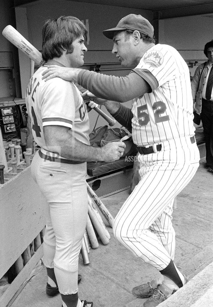 G. Paul Burnett FILE - Joe Pignatano, right, a bullpen coach for the New York Mets, talks with Cincinnati Reds star Pete Rose in New York, July 27, 1978, before a baseball game. Pignatano, who made his major league debut with the Brooklyn Dodgers in 1957 and later was a coach for the Mets, died Monday, May 23, 2022, in Naples, Fla. (AP Photo/G. Paul Burnett, File)