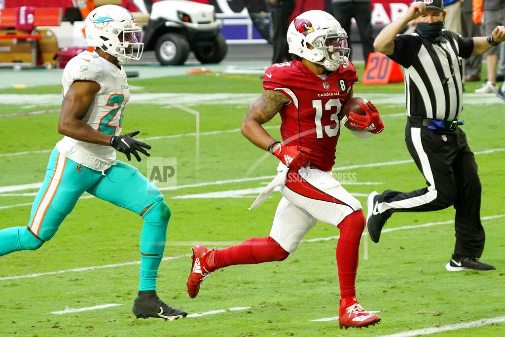 Rick Scuteri Arizona Cardinals wide receiver Christian Kirk (13) scores a touchdown as Miami Dolphins cornerback Byron Jones (24) pursues during the first half of an NFL football game, Sunday, Nov. 8, 2020, in Glendale, Ariz. (AP Photo/Rick Scuteri)