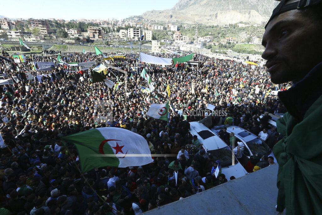 Fateh Guidoum People demonstrate in Kherrata, 300 km (190 miles) east of Algiers, Tuesday, Feb.16, 2021. The first demonstration of the pro-democratic Hirak movement in Algeria took place two years ago in Kherrata when people went to the street to protest against a new mandate of former President Abdelaziz Bouteflika. Residents of Kherrata went back to the street not just to remember two years of the first demonstration but to demand the current government to fulfil its promises. (AP Photo/Fateh Guidoum)