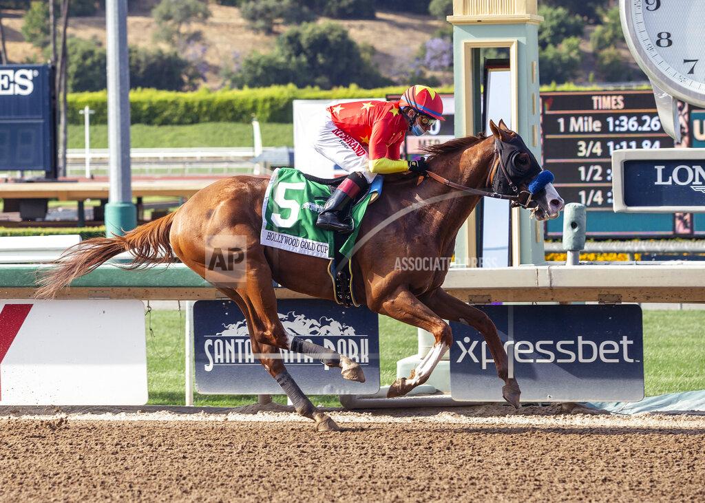 Uncredited In this image provided by Benoit Photo, Improbable, with Drayden Van Dyke aboard, wins the Grade I $300,000 Hollywood Gold Cup horse race Saturday, June 6, 2020, at Santa Anita Park in Arcadia, Calif. (Benoit Photo via AP)