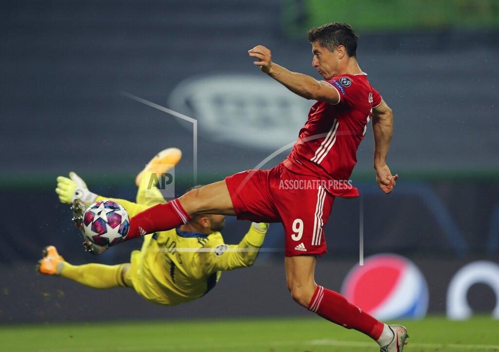 Miguel A. Lopes Lyon's goalkeeper Anthony Lopes tries to stop Bayern's Robert Lewandowski during the Champions League semifinal soccer match between Lyon and Bayern Munich at the Jose Alvalade stadium in Lisbon, Portugal, Wednesday, Aug. 19, 2020. (Miguel A. Lopes/Pool via AP)