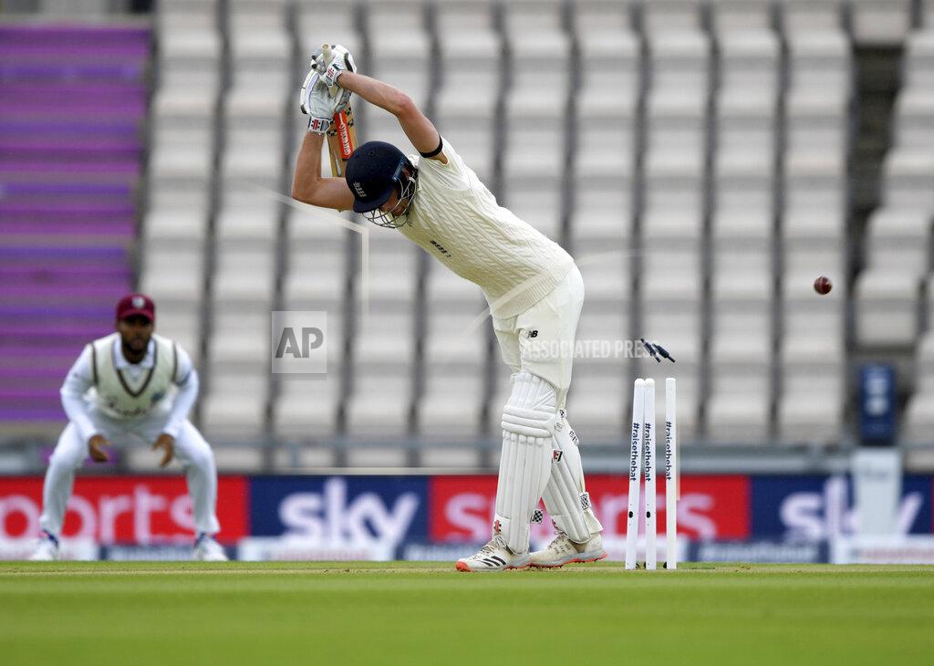 Mike Hewitt England's Dom Sibley is bowled out on the first day of the 1st cricket Test match between England and West Indies, at the Ageas Bowl in Southampton, England, Wednesday July 8, 2020. (Mike Hewitt/Pool via AP)