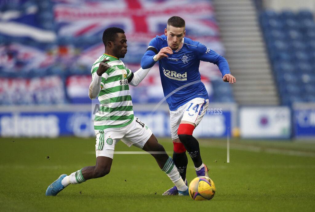 Andrew Milligan Rangers' Ryan Kent and Celtic's Ismaila Soro, left, battle for the ball during the Scottish Premiership soccer match at Ibrox Stadium, Glasgow, Saturday Jan. 2, 2021. (Andrew Milligan/PA via AP)