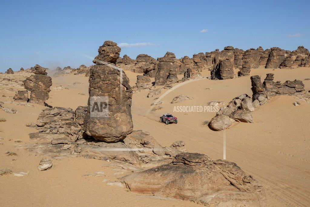 Bernat Armangue Driver Carlos Sainz, of Spain, and co-driver Lucas Cruz, of Spain, race their Mini during stage four of the Dakar Rally between Neom and Al Ula, in Saudi Arabia, Wednesday, Jan. 8, 2020. (AP Photo/Bernat Armangue)