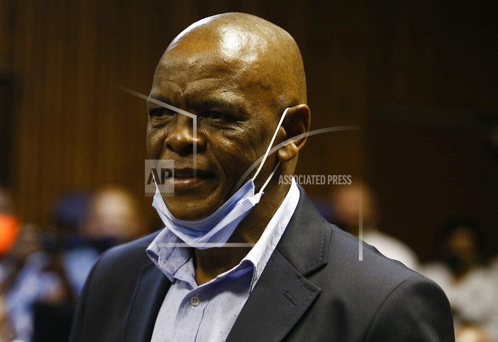 Uncredited African National Congress secretary general Ace Magashule appears for a bail hearing inside the magistrates court in Bloemfontein, South Africa, Friday, Nov. 13, 2020. Magashule is charged in connection with the looting of $13.8 million when he was premier of the Free State province from 2009 until 2018. (AP Photo)