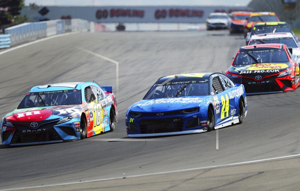 John Munson Kyle Busch (18) and William Byron (24) head into Turn 1 during a NASCAR Cup Series auto race at Watkins Glen International, Sunday, Aug. 4, 2019, in Watkins Glen, N.Y. (AP Photo/John Munson)