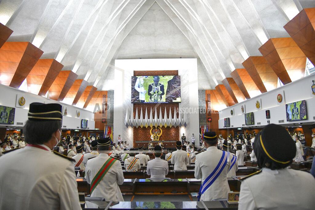 Nazri Rapai In this photo released by Malaysia's Department of Information, Malaysia's King Sultan Abdullah Sultan Ahmad Shah, center, prays during the opening ceremony of the third term of the 14th parliamentary session at parliament house in Kuala Lumpur Monday, May 18, 2020. Malaysia's parliament held an unusual half-day sitting Monday, that was kept short due to the COVID-19 pandemic and saw Prime Minister Muhyiddin Yassin dodge a vote of no-confidence against him over two months since he came into power. (Nazri Rapai/Malaysia's Department of Information via AP)