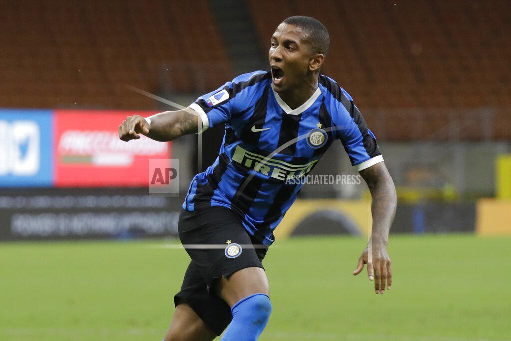 Luca Bruno FILE -- In this July 13, 2020 file photo Inter Milan's Ashley Young celebrates after scoring his side's opening goal during a Serie A soccer match between Inter Milan and Torino, at the San Siro stadium in Milan, Italy. Ashley Young has tested positive for the coronavirus, becoming the sixth Nerazzurri player to contract the virus in the past week. (AP Photo/Luca Bruno)