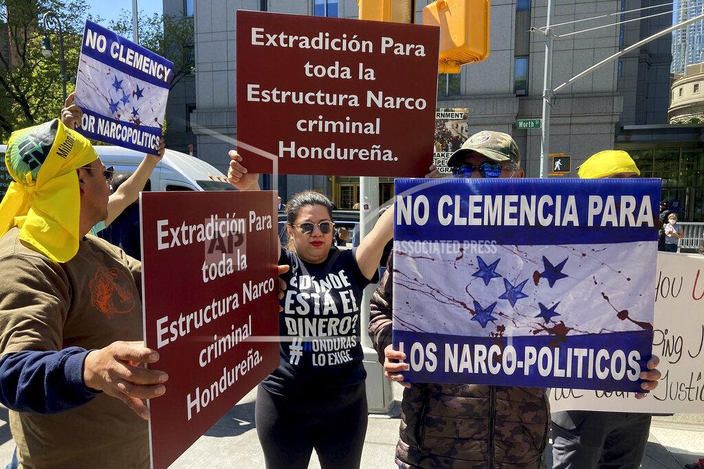 David R. Martin Demonstrators stand outside Manhattan federal court to protest former Honduran President Juan Orlando Hernandez, who pleaded not guilty to charges that he received millions of dollars from 2004 to 2022 to support a drug trade that delivered hundreds of thousands of kilos of drugs to the U.S., Tuesday, May 10, 2022, in New York. (AP Photo/David R. Martin)