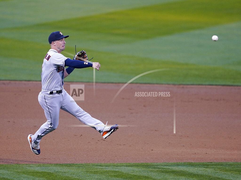 Tony Avelar Houston Astros third baseman Alex Bregman (2) throws to first base for an out against Oakland Athletics' Mark Canha in the first inning of an opening day baseball game Oakland, Calif., Thursday, April 1, 2021. (AP Photo/Tony Avelar)