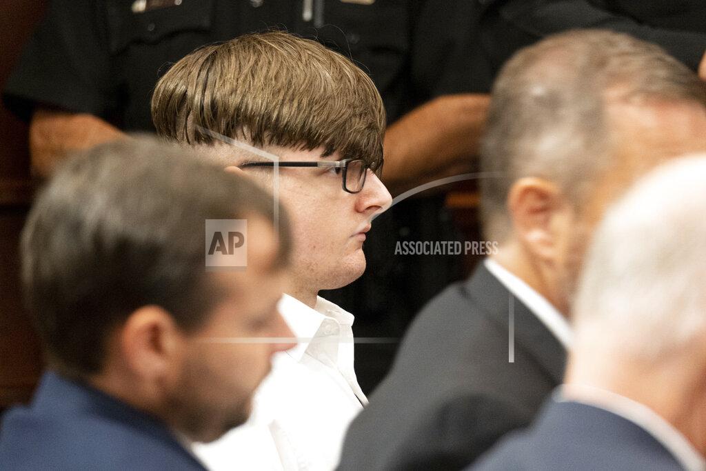 Ben Gray Robert Aaron Long sits in Superior Court of Cherokee County in Canton, Ga., on Tuesday morning, July 27, 2021, before pleading guilty to murder. Long, accused of killing eight people, most of them women of Asian descent, at Atlanta-area massage businesses pleaded guilty to four of the murders. He was handed four sentences of life without parole. (Ben Gray/Atlanta Journal-Constitution via AP, Pool)