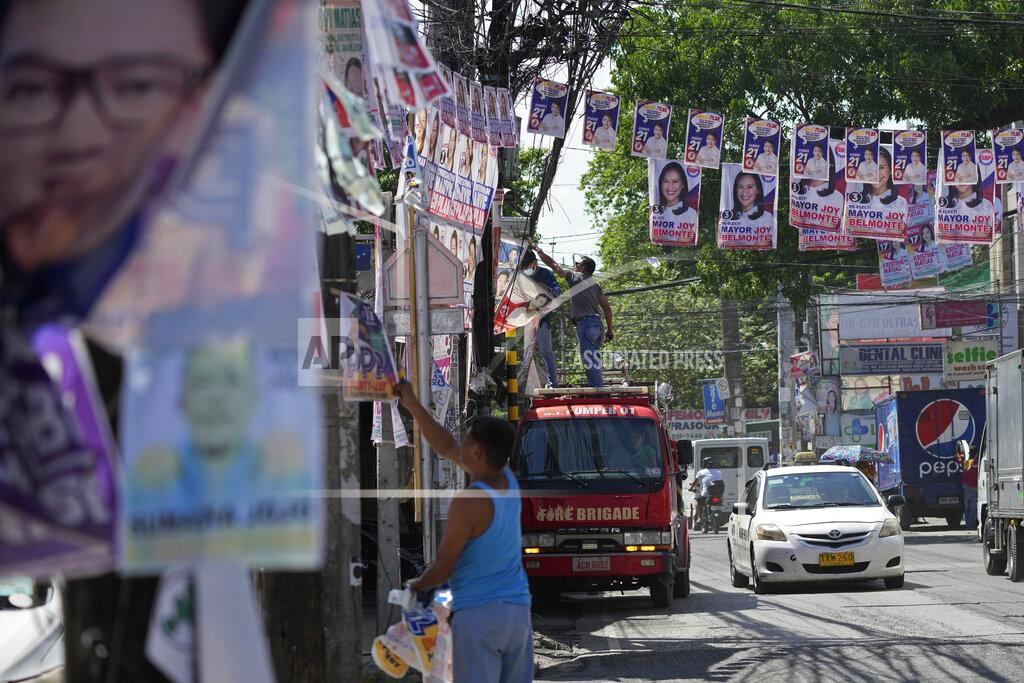 Aaron Favila Village workers remove election campaign posters in Quezon city, Philippines on Wednesday, May 11, 2022. Marcos, the namesake son of longtime dictator Ferdinand Marcos, apparent landslide victory in the Philippine presidential election is raising immediate concerns about a further erosion of democracy in Asia and could complicate American efforts to blunt growing Chinese influence and power in the Pacific. (AP Photo/Aaron Favila)