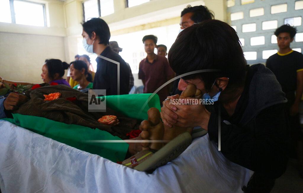 Uncredited A family member mourns over the death of Aung Myo Thant as they gather at his funeral in Yangon, Myanmar, Tuesday, March 30, 2021. Family members said Aung Myo Thant was killed Monday during a clash with security forces at a protest against the military's coup that ousted the government of Aung San Suu Kyi on Feb. 1. (AP Photo)