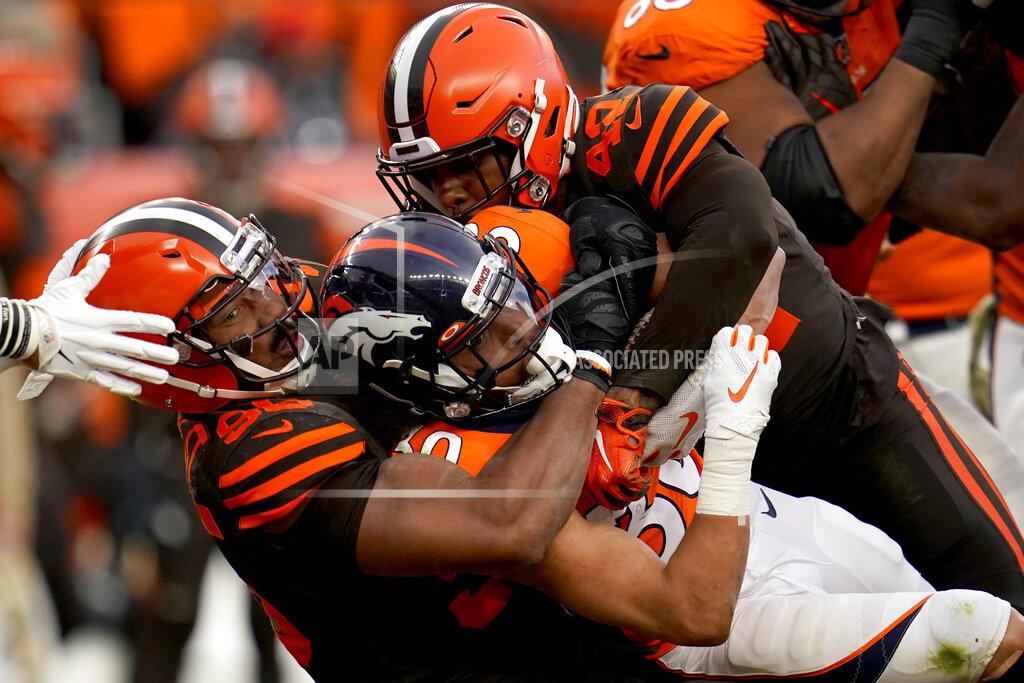 Jack Dempsey Denver Broncos running back Phillip Lindsay, center, is tackled by Cleveland Browns defensive tackle Sheldon Richardson, left, during the second half of NFL football game, Sunday, Nov. 3, 2019, in Denver. (AP Photo/Jack Dempsey)