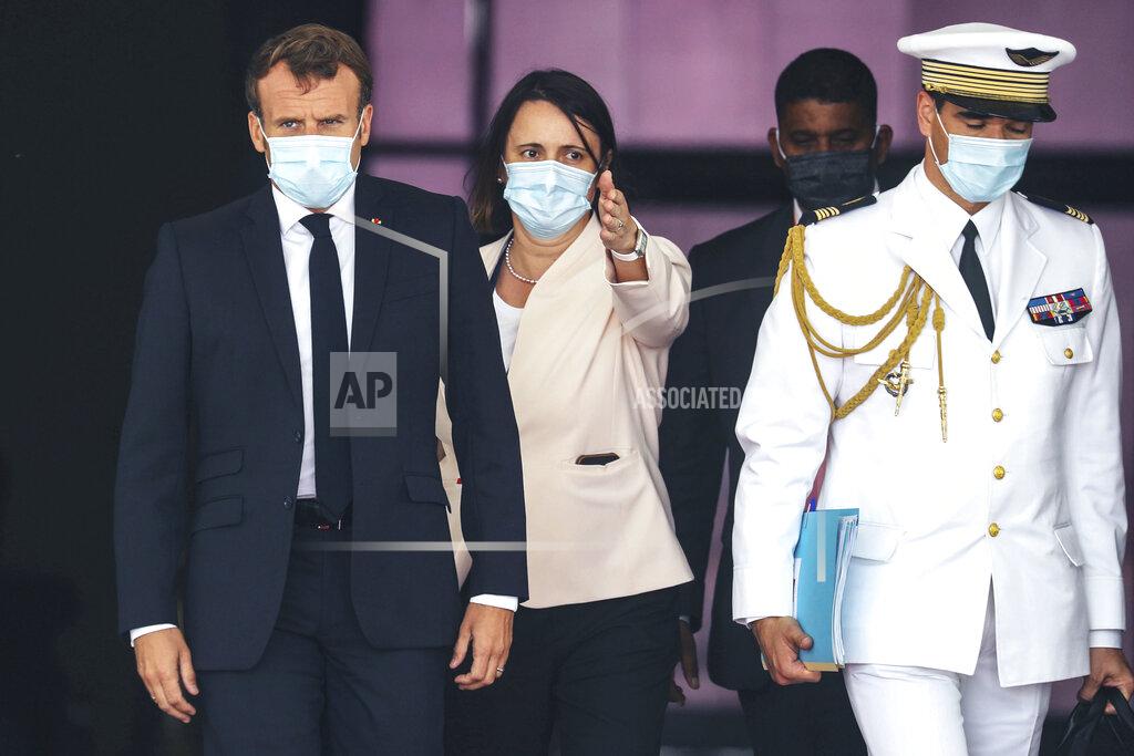 Ludovic Marin French President Emmanuel Macron, left, wears a face mask as he arrives at Nouakchott Oumtounsy International Airport Tuesday June 30, 2020, in Nouakchott, to attend a G5 Sahel summit. Leaders from the five countries of West Africa's Sahel region, Burkina Faso, Chad, Mali, Mauritania and Niger, meet with French President Emmanuel Macron and Spanish Prime Minister Pedro Sanchez in Mauritania's capital Nouakchott on Tuesday to discuss military operations against Islamic extremists in the region, as jihadist attacks mount. The five African countries, known as the G5, have formed a joint military force that is working with France, which has thousands of troops to battle the extremists in the Sahel, the region south of the Sahara Desert. (Ludovic Marin, Pool via AP)