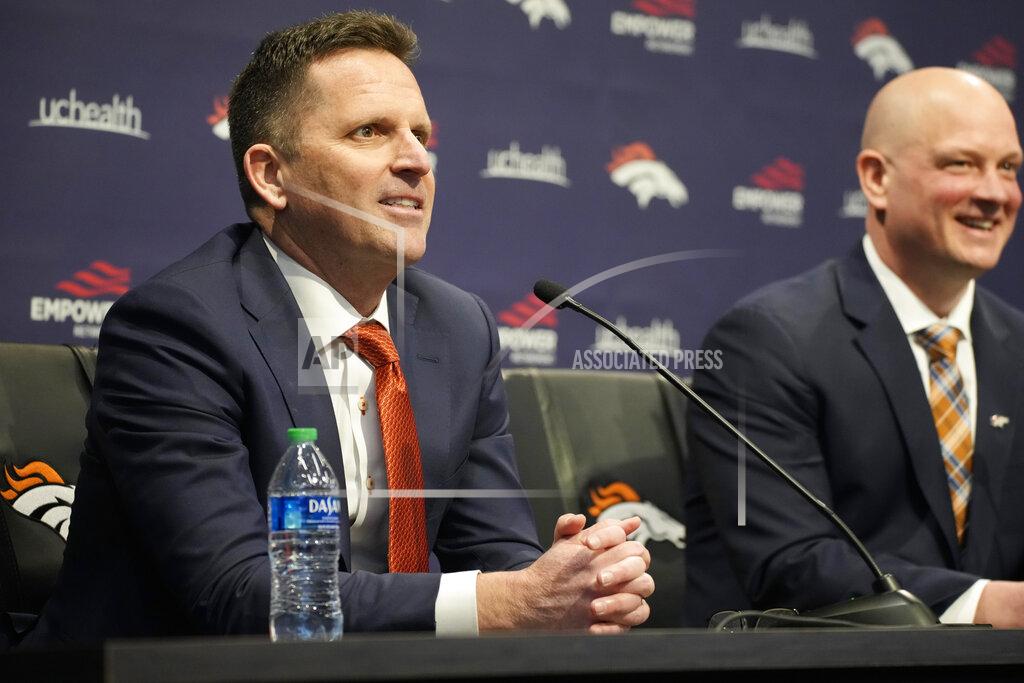 David Zalubowski Denver Broncos general manager George Paton, left, deflects a question from a reporter as new head coach Nathaniel Hackett, right, looks on during a news conference to introduce Hackett, Friday, Jan. 28, 2022, at the NFL football team's headquarters in Englewood, Colo. (AP Photo/David Zalubowski)