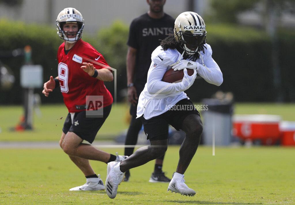 Gerald Herbert New Orleans Saints running back Alvin Kamara runs through drills with quarterback Drew Brees (9) during an NFL football practice in Metairie, La., Thursday, May 23, 2019. (AP Photo/Gerald Herbert)