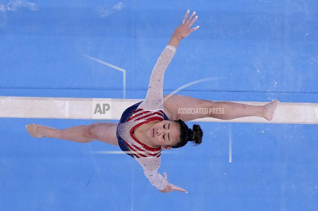 FILE - In this July 29, 2021, file photo, Sunisa Lee, of the United States, performs on the balance beam during the artistic gymnastics women's all-around final at the 2020 Summer Olympics, in Tokyo. Gymnastics, now among the Olympics’ most beloved events, was born millennia ago, as young men trained for war in the buff. (AP Photo/Morry Gash, File)