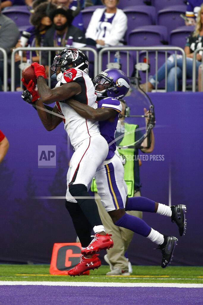 Atlanta Falcons wide receiver Julio Jones catches a 2-yard touchdown pass ahead of Minnesota Vikings cornerback Mark Fields, right, during the second half of an NFL football game Sunday, Sept. 8, 2019, in Minneapolis. (AP Photo/Bruce Kluckhohn)