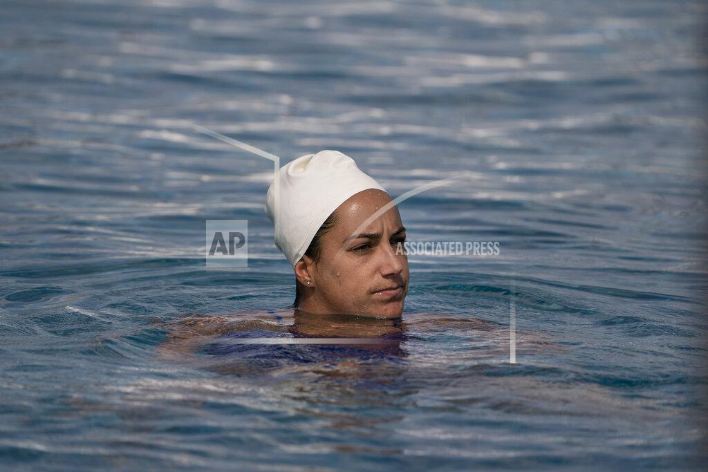 Jae C. Hong Maggie Steffens, a member of the U.S. women's water polo team, pauses for a moment while training at MWR Aquatic Training Center Tuesday, April 27, 2021, in Los Alamitos, Calif. Steffens is going for a third consecutive gold medal with the U.S. women's water polo team at the Tokyo Olympics this summer. Steffens became team captain in 2014, and that role maybe took on some added significance while the U.S. served as its own opponent for 15 months before it swept a three-game series against Canada in May. (AP Photo/Jae C. Hong)