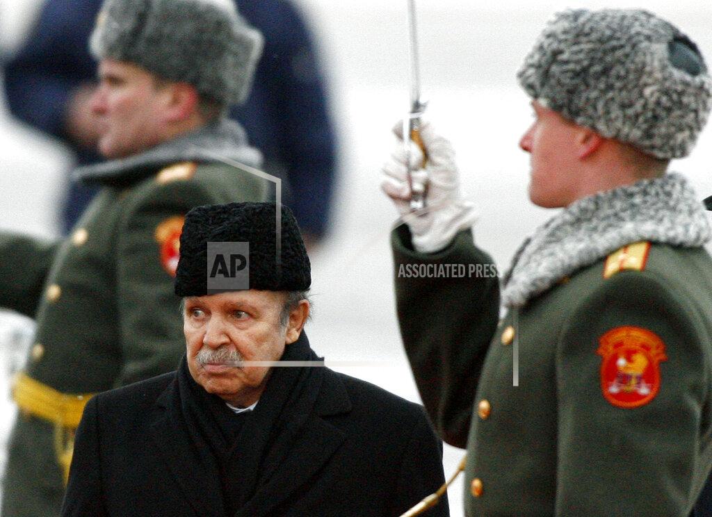 Mikhail Metzel FILE - In this Monday, Feb. 18, 2008, file photo Algeria's President Abdelaziz Bouteflika attends an official welcome ceremony on his arrival to Moscow. Former Algerian President Bouteflika, who fought for independence from France in the 1950s and 1960s and was ousted amid pro-democracy protests in 2019 after 20 years in power, has died at age 84, state television announced Friday, Sept. 17, 2021. (AP Photo/Mikhail Metzel, File)
