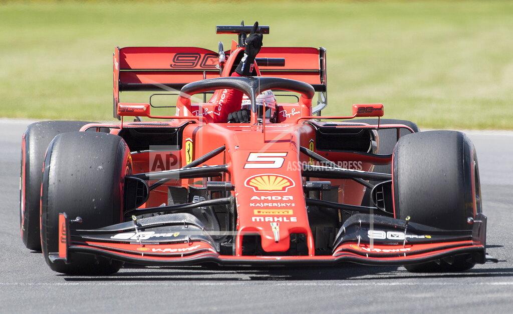 Graham Hughes Ferrari driver Sebastian Vettel of Germany gestures after winning pole position during qualifying for the Formula One Canadian Grand Prix auto race in Montreal, Saturday, June 8, 2019. (Graham Hughes/The Canadian Press via AP)