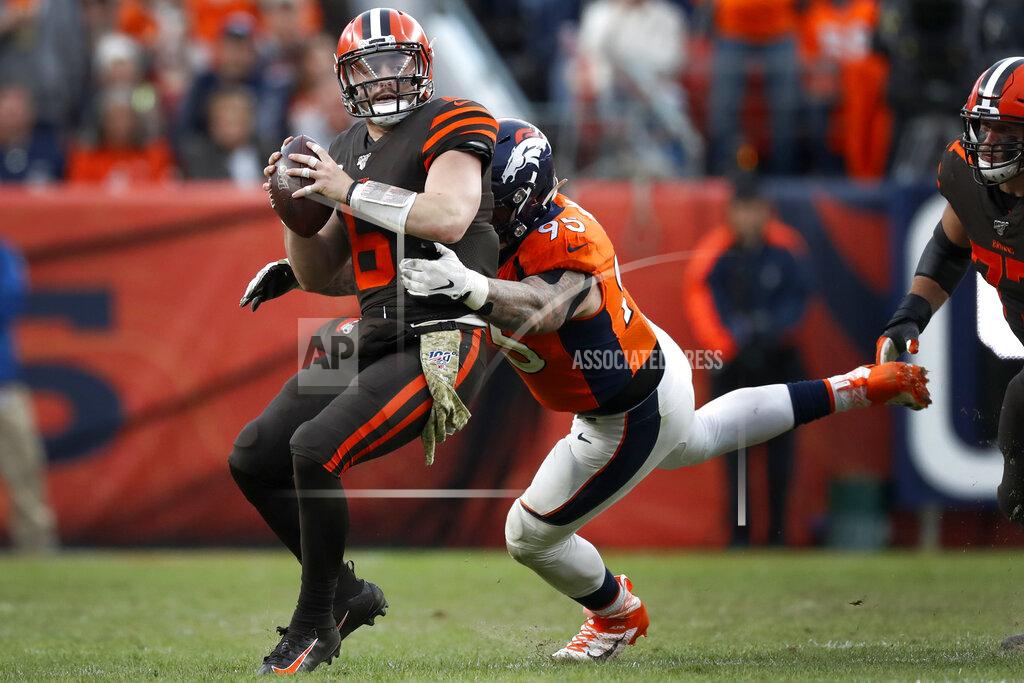David Zalubowski Cleveland Browns quarterback Baker Mayfield (6) is sacked by Denver Broncos defensive end Derek Wolfe (95) during the second half of NFL football game, Sunday, Nov. 3, 2019, in Denver. (AP Photo/David Zalubowski)