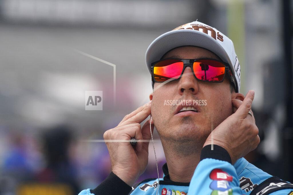 Lm Otero Kyle Busch adjusts his earpieces as he stands in pit row during qualifying for a NASCAR All-Star Race auto race at Texas Motor Speedway in Fort Worth, Texas, Saturday, May 21, 2022. (AP Photo/LM Otero)