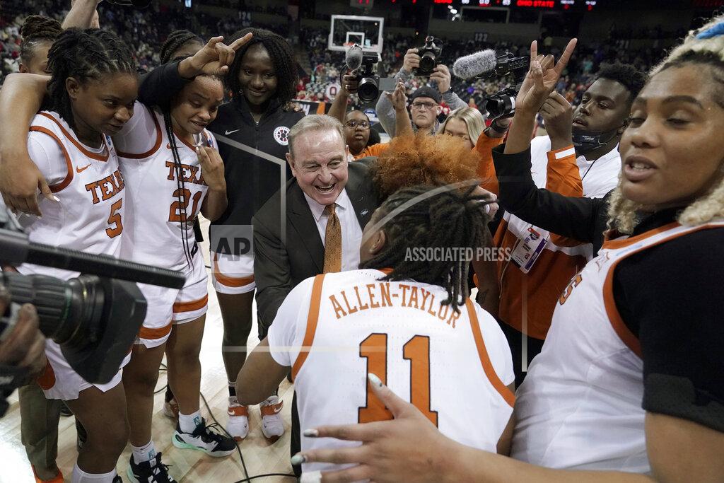 Ted S. Warren Texas head coach Vic Schaefer reacts with guard Joanne Allen-Taylor (11) as he huddles with his team after a college basketball game against Ohio State in the Sweet 16 round of the NCAA tournament, Friday, March 25, 2022, in Spokane, Wash. Texas won 66-63. (AP Photo/Ted S. Warren)