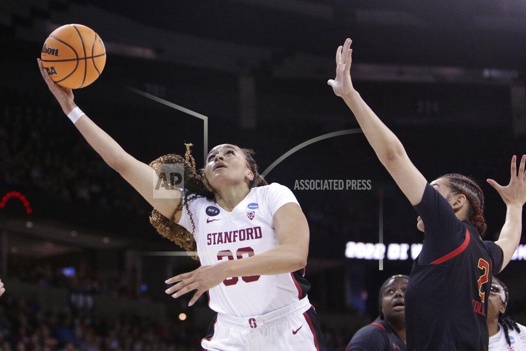 Young Kwak CORRECTS STANFORD PLAYER TO HALEY JONES, INSTEAD OF ELENA BOSGANA - Stanford guard Haley Jones, left, puts up a shot against Maryland forward Mimi Collins, right, during the first half of a college basketball game in the Sweet 16 round of the NCAA tournament Friday, March 25, 2022, in Spokane, Wash. (AP Photo/Young Kwak)
