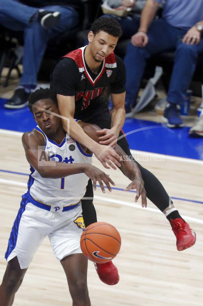 Keith Srakocic Northern Illinois's Trendon Hankerson, top, jumps on Pittsburgh's Xavier Johnson as he tries for the ball during the second half of an NCAA college basketball game, Monday, Dec. 16, 2019, in Pittsburgh. Pittsburgh won 59-50. (AP Photo/Keith Srakocic)