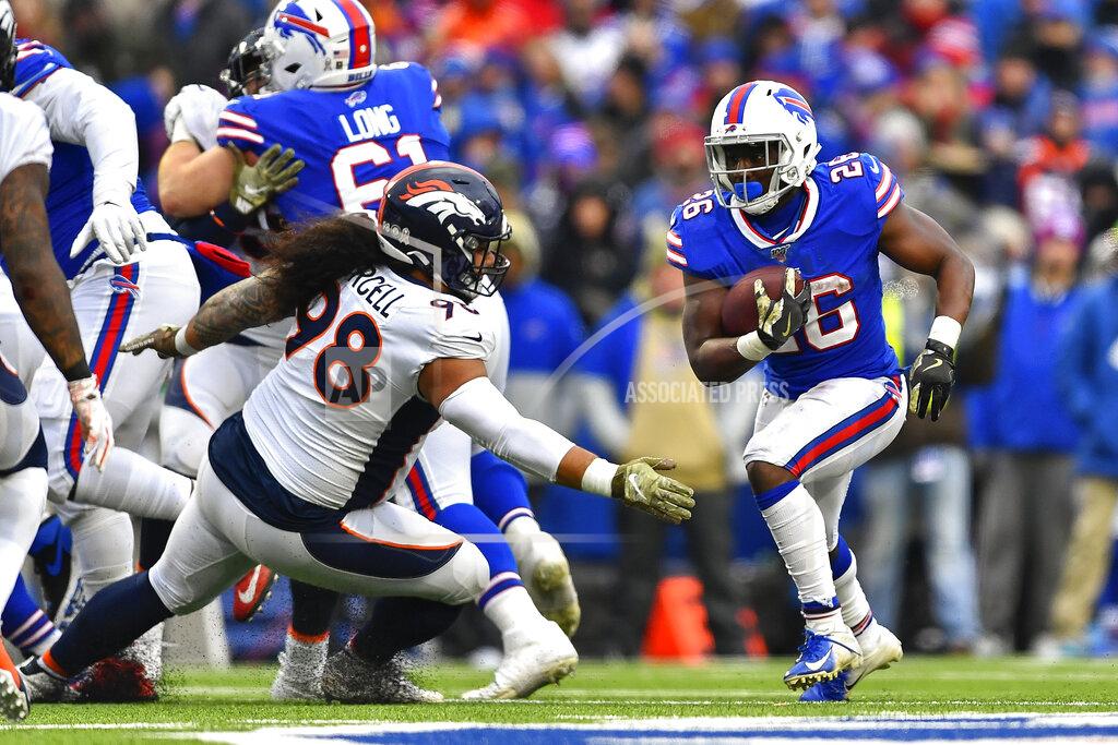 Adrian Kraus Buffalo Bills running back Devin Singletary (26) runs the ball against the Denver Broncos during the fourth quarter of an NFL football game, Sunday, Nov. 24, 2019, in Orchard Park, N.Y. (AP Photo/Adrian Kraus)