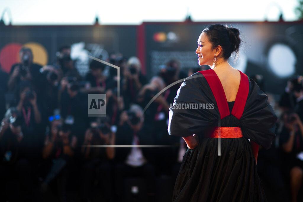 Arthur Mola File - Actress Gong Li poses for photographers upon arrival at the premiere of the film 'Saturday Fiction' at the Venice Film Festival. The 77th Venice Film Festival will kick off on Wednesday, Sept. 2, 2020, but this year's edition will be unlike any others. Coronavirus restrictions will mean fewer Hollywood stars, no crowds interacting with actors and other virus safeguards will be deployed. (Photo by Arthur Mola/Invision/AP, File)