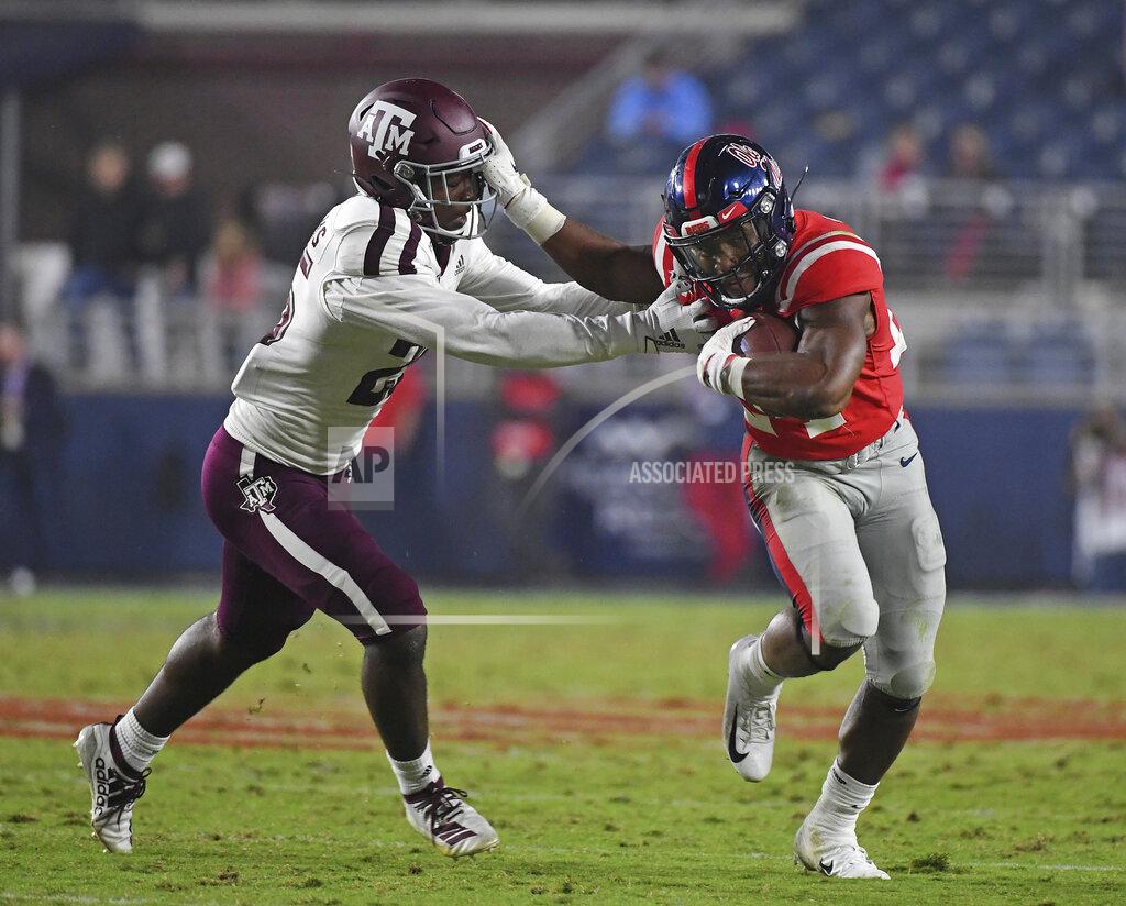 Thomas Graning Mississippi running back Snoop Conner (24) stiff-arms Texas A&M defensive back Brian Williams (25) during the second half of an NCAA college football game in Oxford, Miss., Saturday, Oct. 19, 2019. (AP Photo/Thomas Graning)