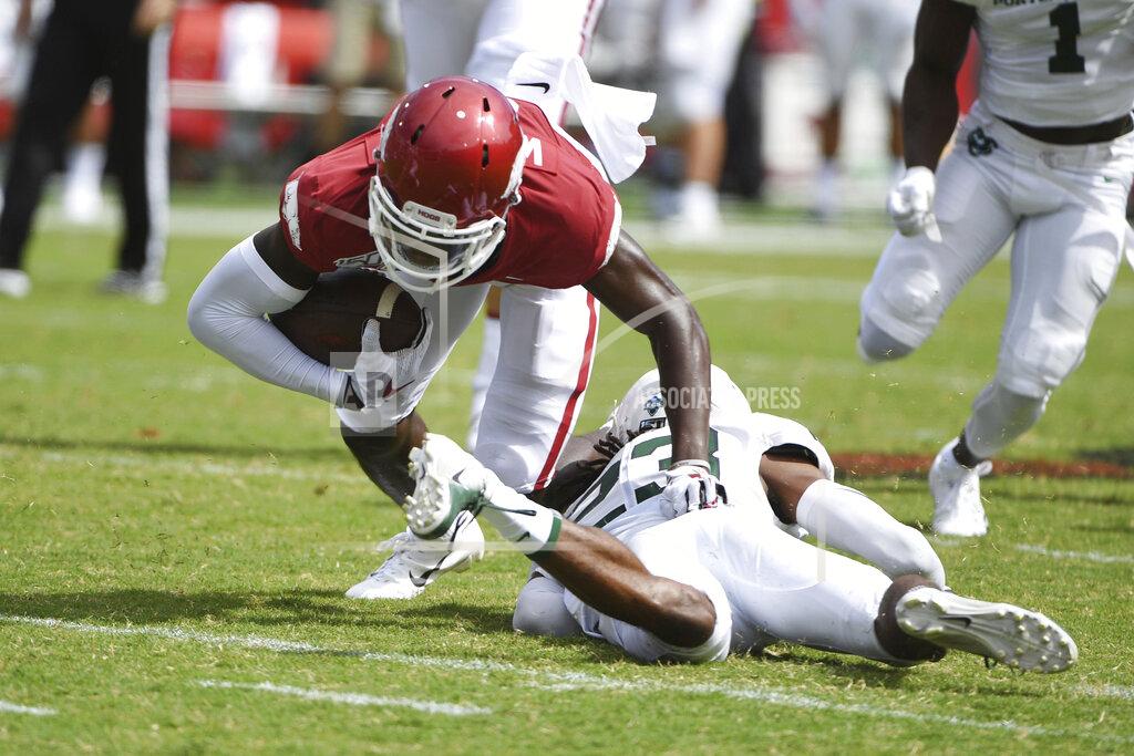 Michael Woods Arkansas receiver Mike Woods tries to get past Portland State defender Montre Brown in the first half of an NCAA college football game, Saturday, Aug. 31, 2019 in Fayetteville, Ark. (AP Photo/Michael Woods)